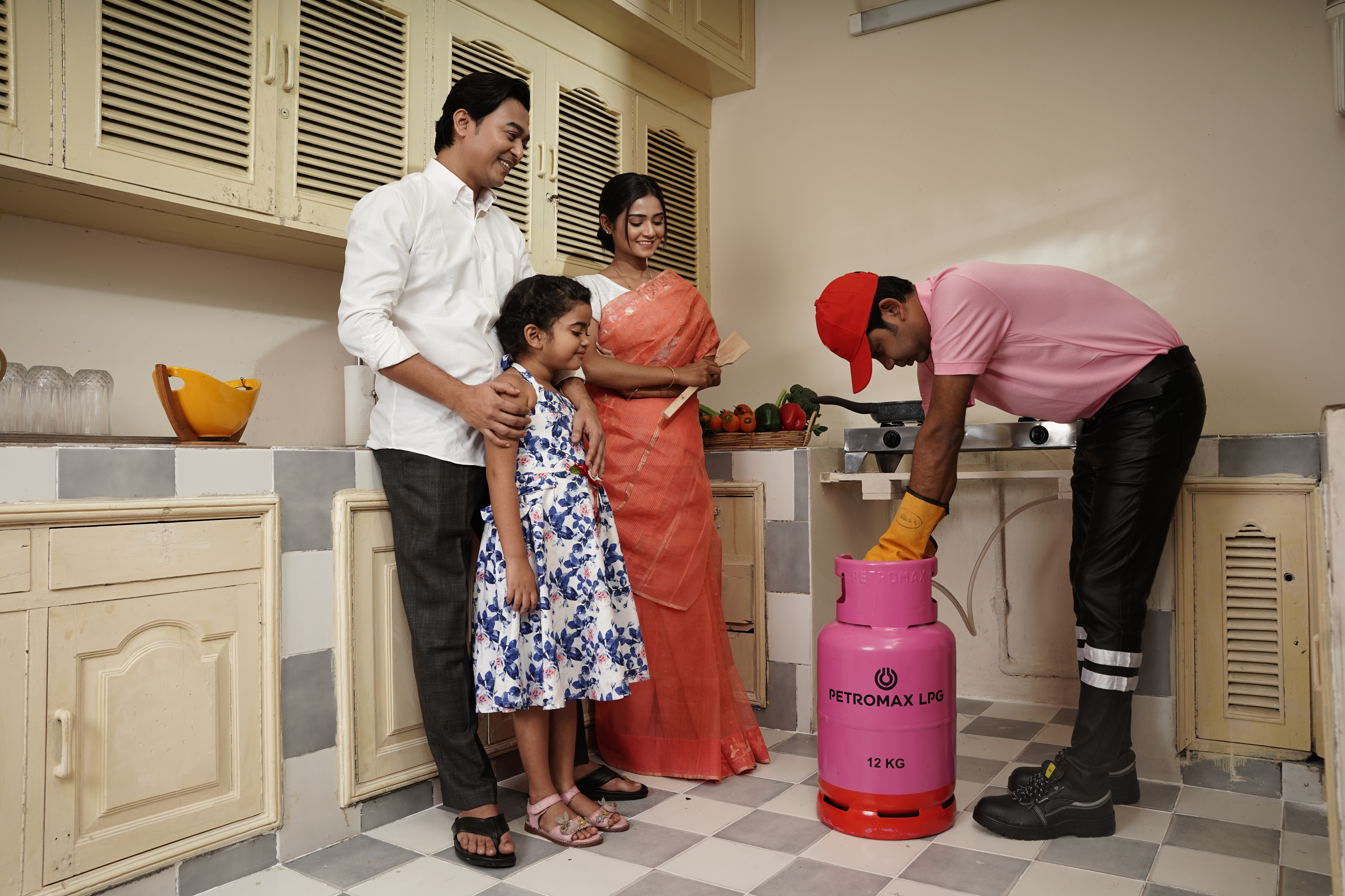 Petromax LPG home delivery technician setting up cylinder for Bangladeshi household