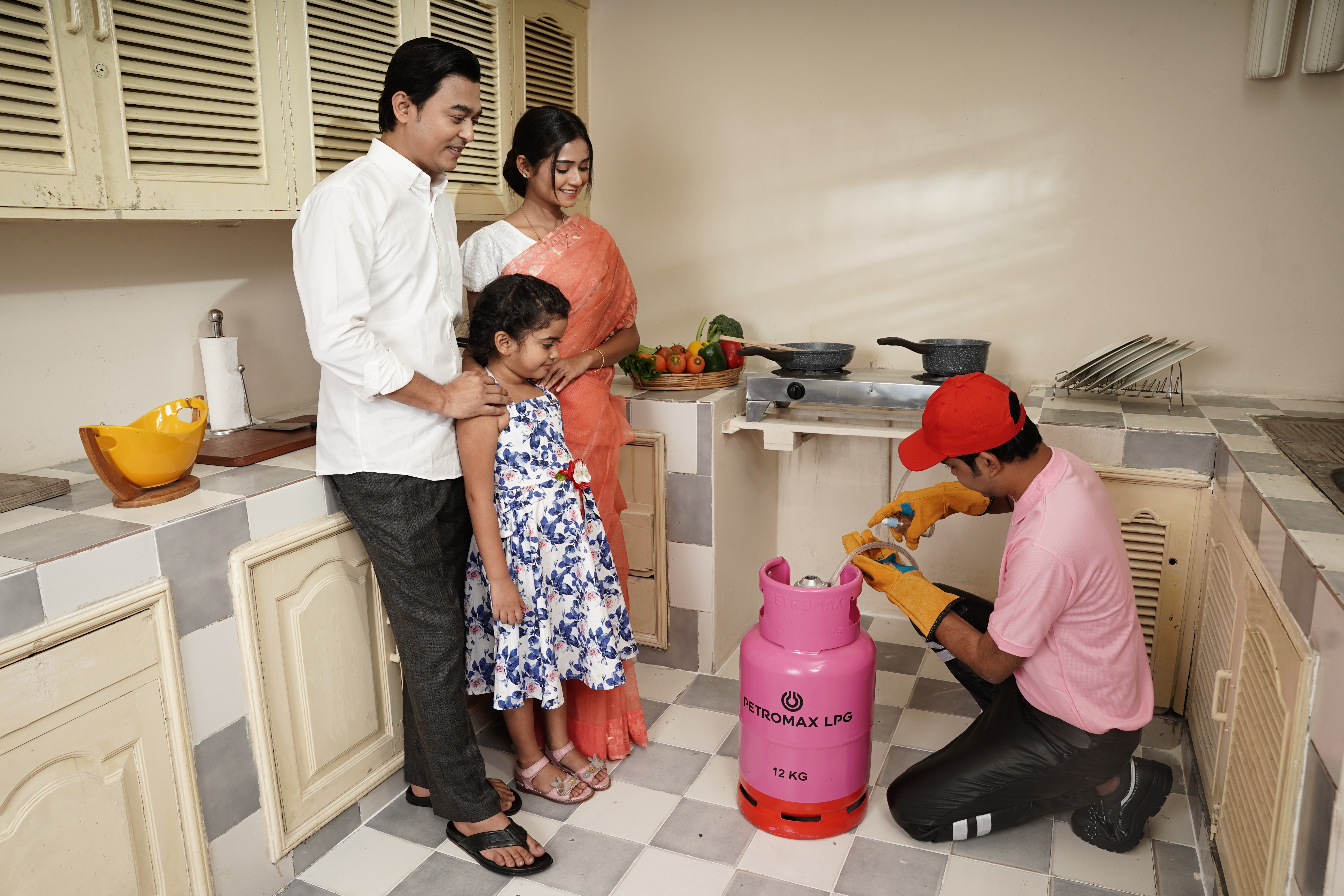 Petromax LPG team explaining safe cylinder usage to family at home